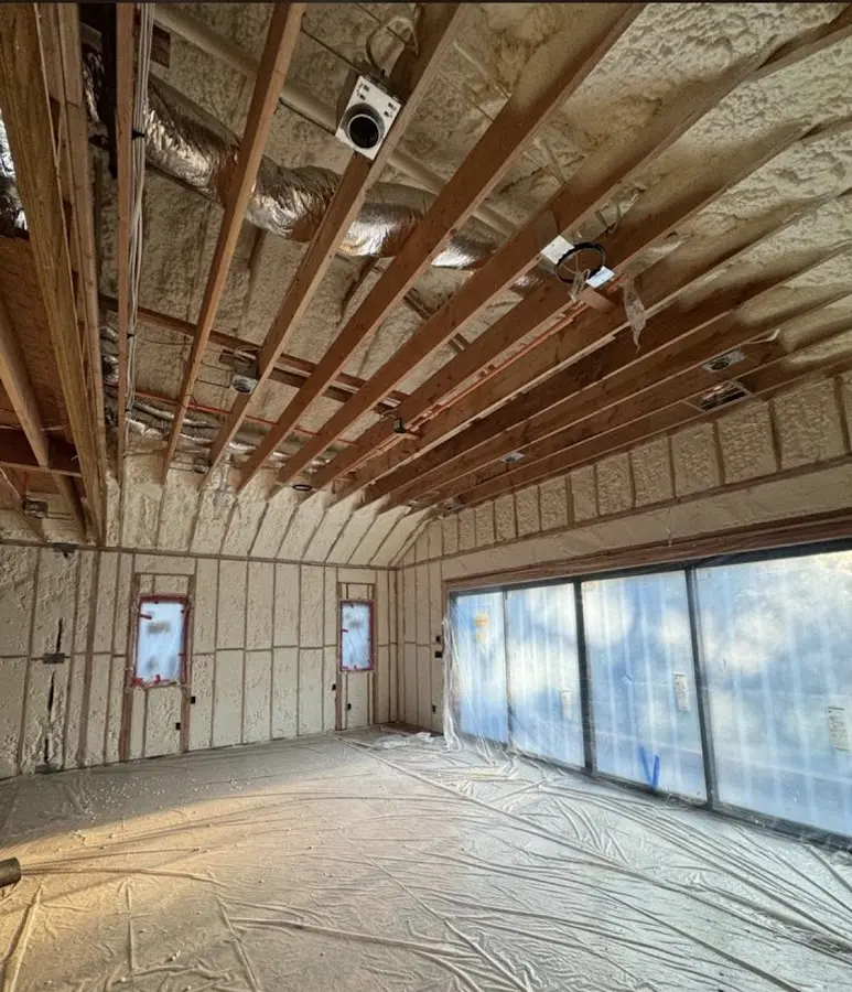 Interior walls and ceiling insulated with spray foam during new construction in Ogden